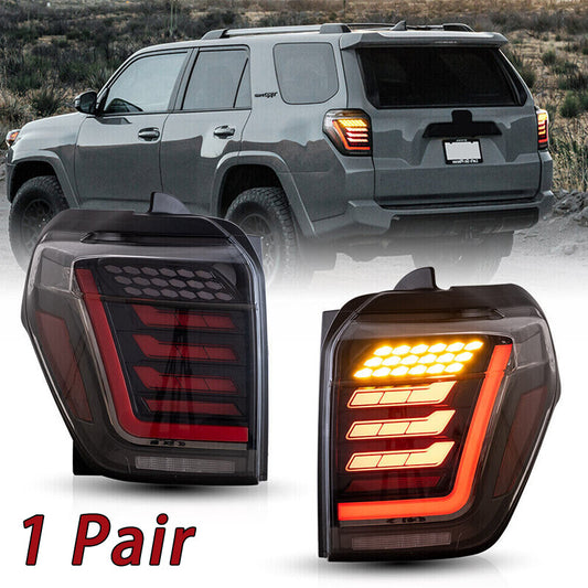 A pair of taillights for the 2014-21 for Toyota 4Runner, featuring transparent LED brake light assemblies.