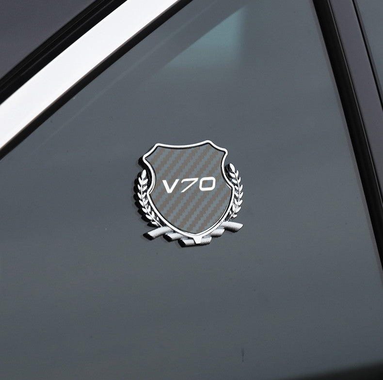 Carbon-plated side fender and window badge stickers for Volvo C70 cars.