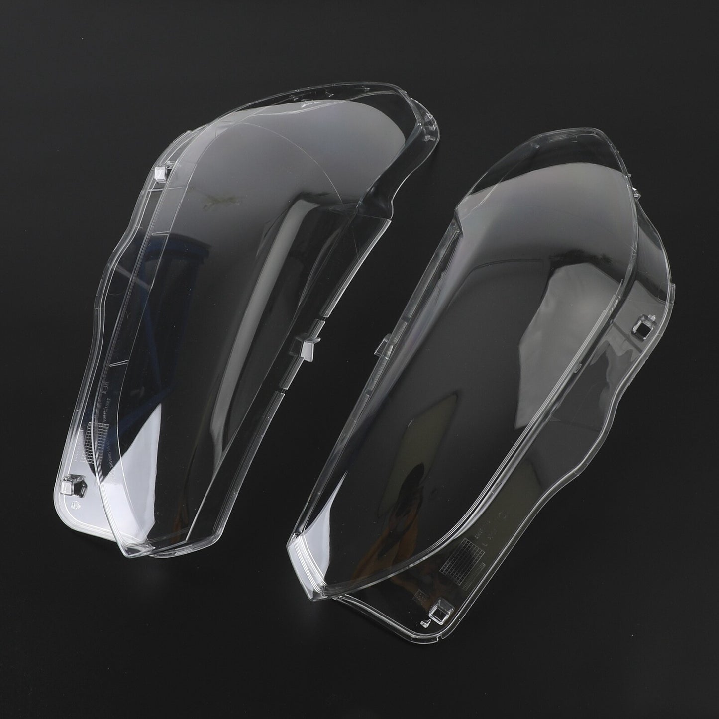 A pair of transparent headlight lens replacement covers for BMW X3 X4 G01 G02 G08 2018-2021